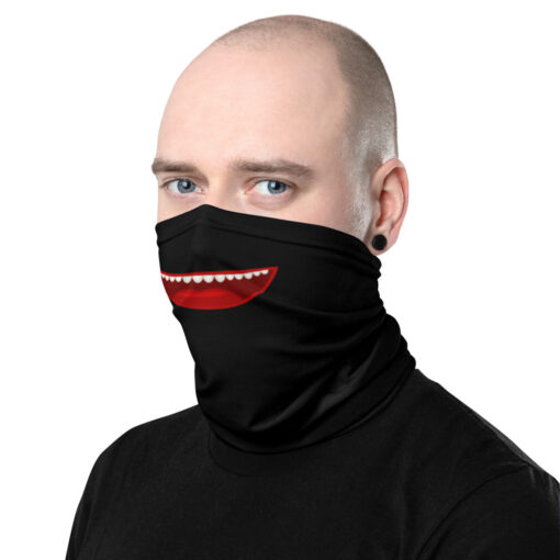 a person wearing a black gaiter featuring a cartoon open smiling mouth with rounded teeth