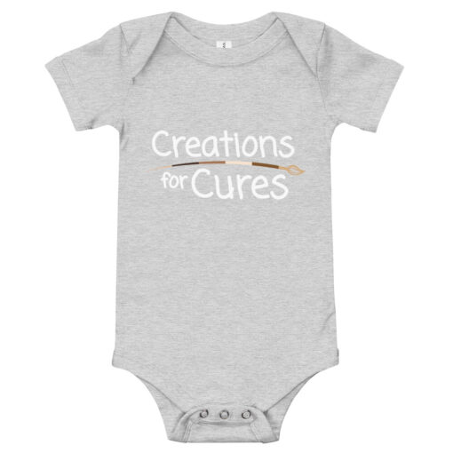 a heather grey short-sleeve baby one-piece featuring the Creations for Cures with diverse skin tone paintbrush