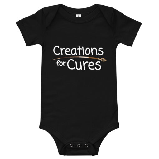 a black short-sleeve baby one-piece featuring the Creations for Cures with diverse skin tone paintbrush