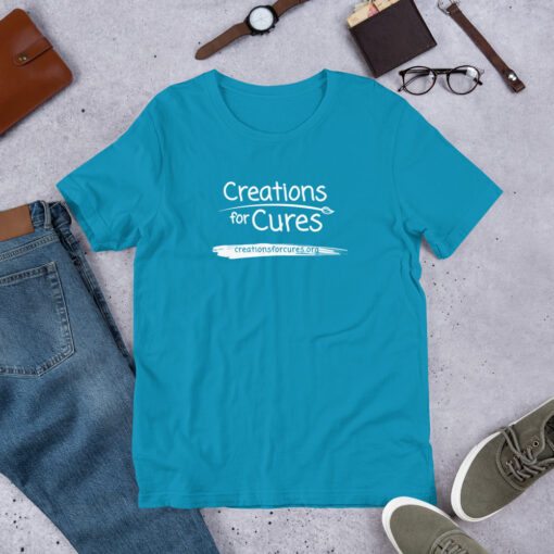 an aqua t-shirt featuring the Creations for Cures logo in white