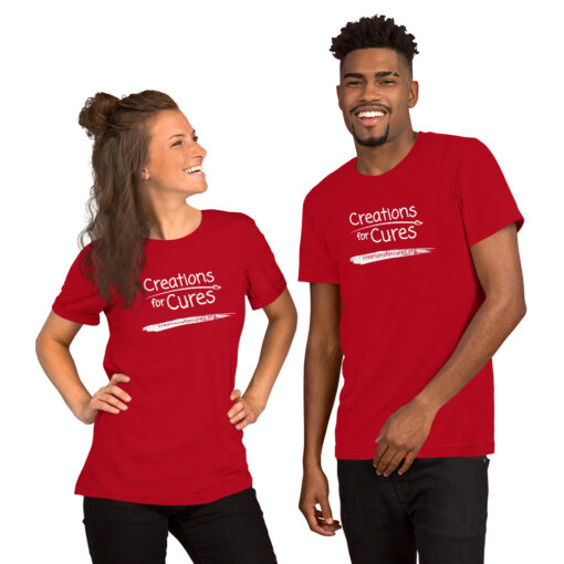 two people wearing red t-shirts featuring the Creations for Cures logo in white