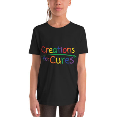 a person wearing a black t-shirt featuring the Creations for Cures logo in rainbow lettering