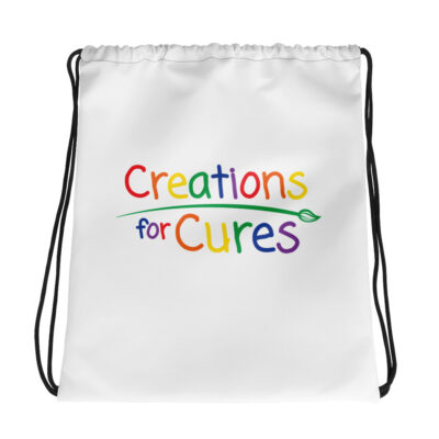 a white drawstring bag featuring the Creations for Cures logo with rainbow lettering