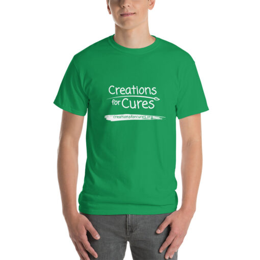 a person wearing a kelly green t-shirt featuring the Creations for Cures logo in white