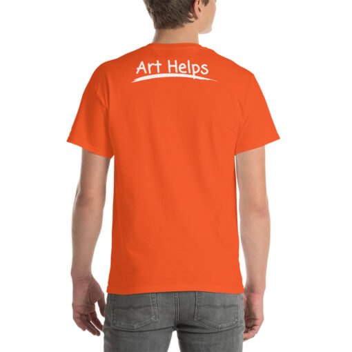 back view of a person wearing an orange t-shirt featuring the phrase "Art Helps" in white