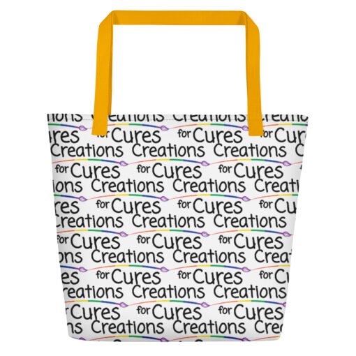 a large tote bag with interior pocket and yellow straps that features the Creations for Cures logo