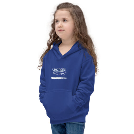 a person wearing a kids size royal blue hoodie featuring the Creations for Cures logo