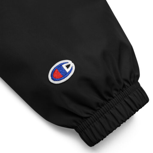 the cuff of a black Champion pullover jacket
