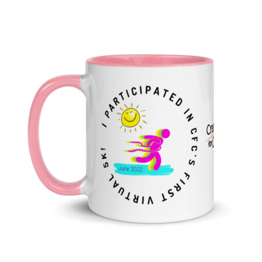 a white ceramic mug with pink handle and interior with artwork saying "I co-founded CFC's first ever virtual 5k!"